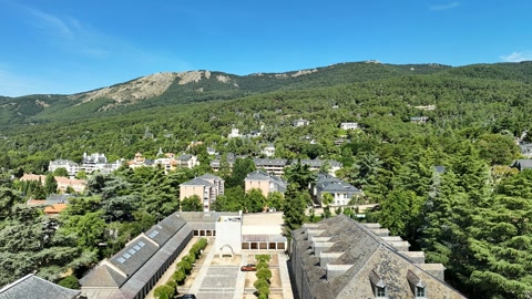 Village near forested mountains — Stillmotion